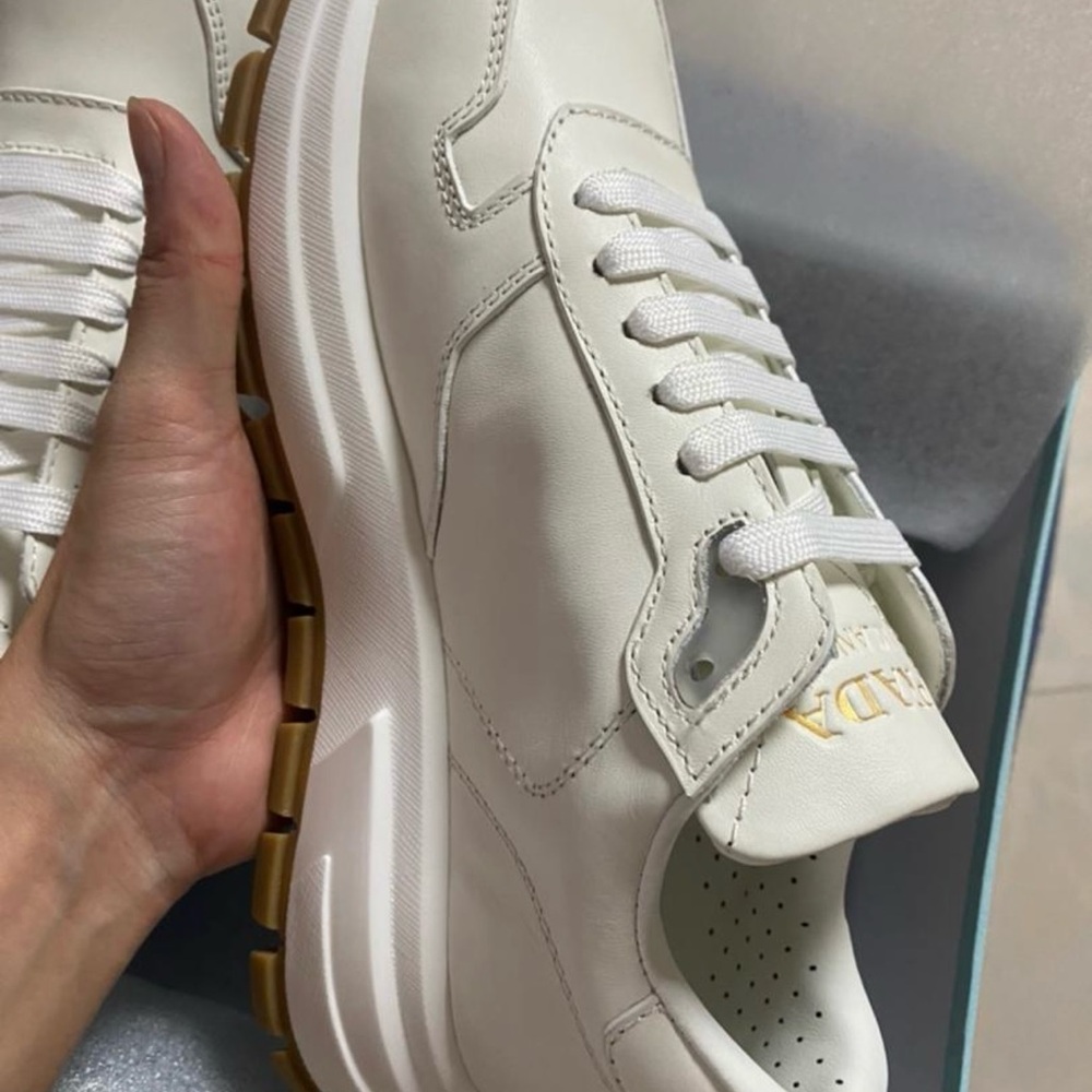 Prada White Sneakers with Gold Accents - Picture 2 of 5